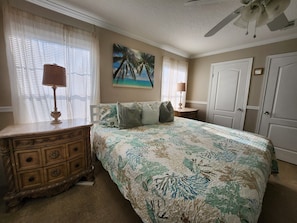 Master Bedroom with King Size Bed, ceiling fan, 55" Samsung Smart TV.