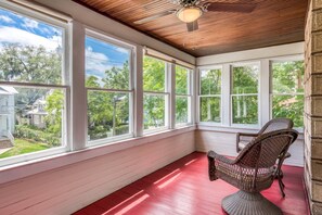 Enjoy coffee or people watching from your private sunroom balcony.