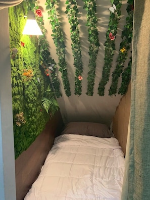 Fairy garden nook with twin bed.