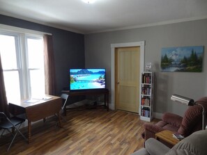 Living room with recliners and Roku TV