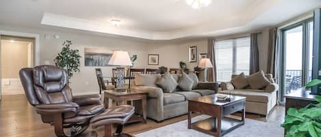 Living room - This condo is warm and inviting with rich honey toned wood floors and gorgeous décor to match.