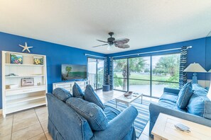 Spacious great room with a queen sized sofa sleeper and matching love seat