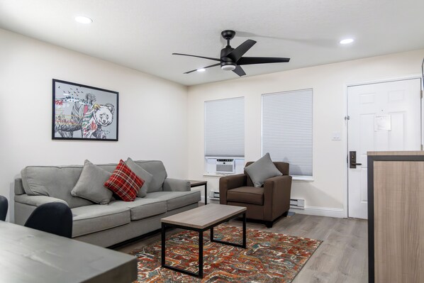 Spacious living area featuring a Queen sleeper sofa