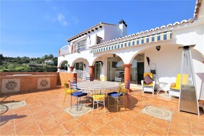 Large patio/terrace with bar area and plenty of relaxing outdoor seating