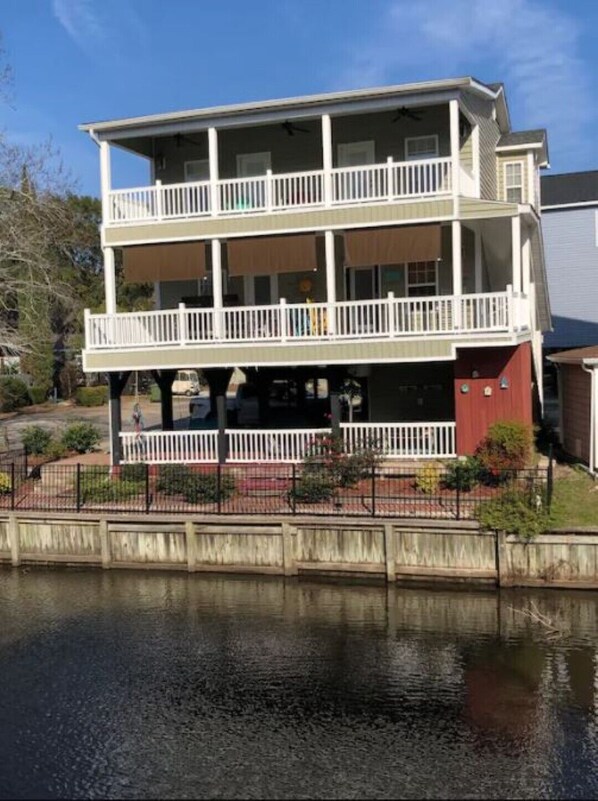 Lake Front View of covered porches and gated exterior area