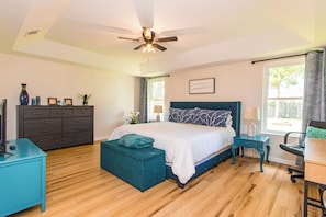 The master suite with king-size bed offers privacy from the other rooms