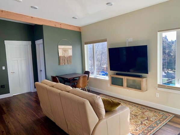 Relax and enjoy the west facing windows as you kick your feet back on a leather reclining sofa.  Smart TV with Netflix, Prime and local channels.