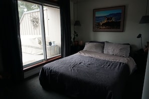 Bedroom with queen sized bed- healthy home bonus: organic memory foam mattress