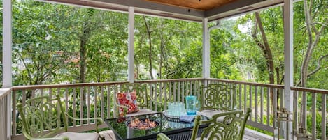 Private outdoor deck boasts a fire pit and seating for 4.