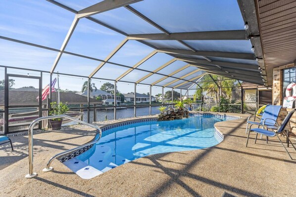 Unwind in style! Soak up the sun and enjoy breathtaking views of the canal from the serene pool.