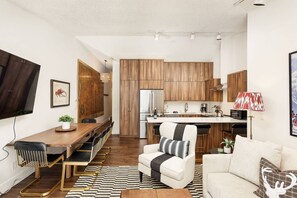 The vaulted ceilings, deluxe kitchen and large welcoming dining area create an inviting atmosphere for dining.