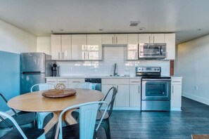 Enjoy home-cooked or the neighborhood's best take-out in the lovely kitchen with stainless steel appliances, a microwave, and a full-sized refrigerator.