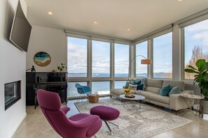 Living Room View. Ferries are always crossing. Leather sectional, gas fireplace.