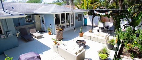 The view from the private, back deck. Surrounded by tall tropical trees.