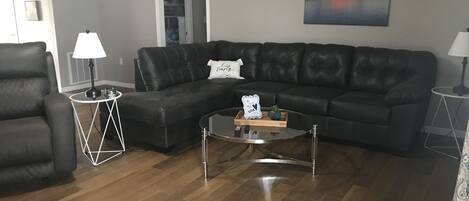 Sectional sofa with recliner located in living room