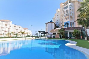 View of the inviting swimming pool in the community, 200m distance from property