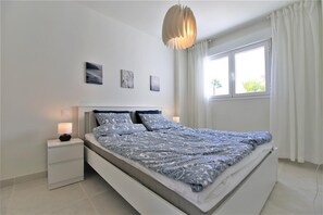 Master bedroom with king size bed, air conditioning and en-suite bathroom