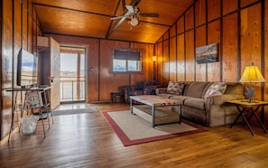 Open living room, dining area and kitchen