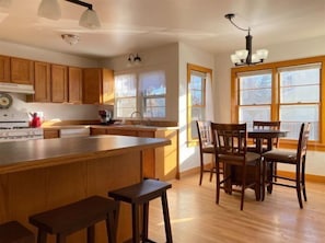 Countertop bar looking into dining room and kitchen