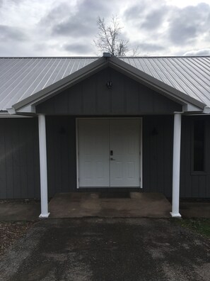 Front of building.  Enter Unit 1 at door with deck on side of building.