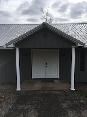 Front of building. Enter Unit 1 at door with deck on side of building.