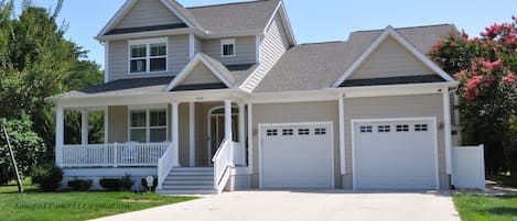 Garage will accommodate 2 cars; 4 Cars in driveway. 