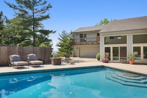 40 ft heated pool with diving board, electric cover. Also has view of the lake. 