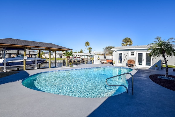 Backyard with Salt Pool, Canal views, hot-tub, and outdoor cabana bar with AC.