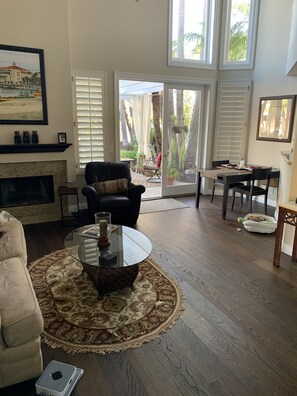 Living room with double wide doors opening on to pool