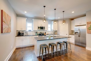 Kitchen with coffee maker, microwave, and more