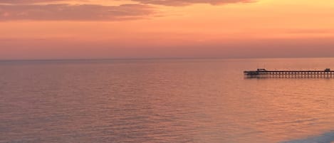 Balcony view looking towards sunset over Apache Pier