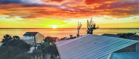 Magnificent sunsets over the Gulf of Mexico are just 50 steps away.