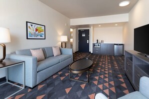 This unit comes with a flat screen TV, microwave, mini-refrigerator and a sofa