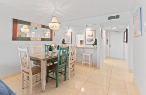 Gather around this charming dining table for a meal with loved ones, sharing laughter and stories