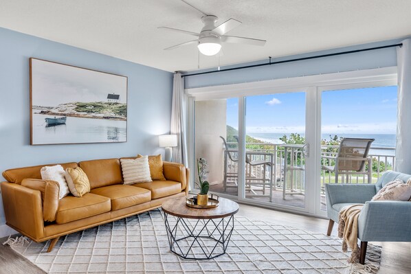 Bright living area with stunning ocean views—perfect for relaxing.