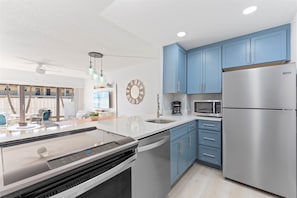 Whip up tasty meals in this cheerful, sunlit kitchen, perfectly positioned for effortless patio dining and laid-back living!