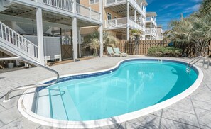 Private pool in fenced back yard with loungers