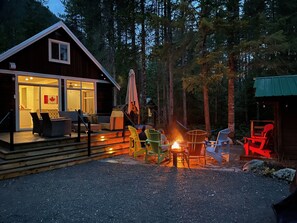 Main Cottage back deck and flagstone campfire area. 
