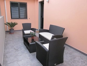 Terrace with rattan table and chairs