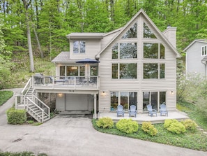 Front View of Home with gorgeous windows overlooking the lake.  