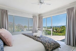 Master bedroom views located upstairs with a king bed