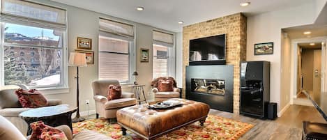 Bright and Spacious Living Area with Custom Fireplace.