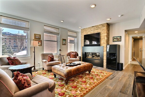 Bright and Spacious Living Area with Custom Fireplace.