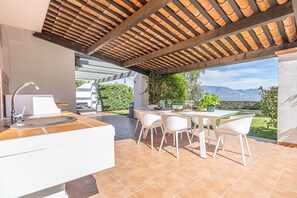 Nice dining area covered with barbecue