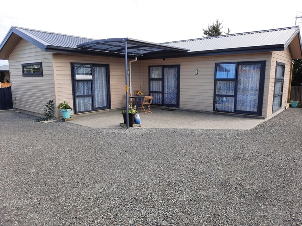 Private courtyard, has a keygola shading for hot days or wet weather.