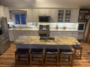 Huge kitchen island with comfortable seating for 5 