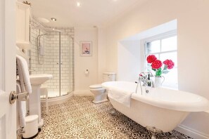 Bath, Shower with Metro tiles, sink &amp; WC.