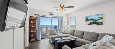 The ocean front living room is well-appointed with comfortable furnishings.