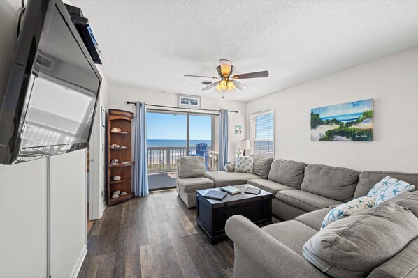 The ocean front living room is well-appointed with comfortable furnishings.