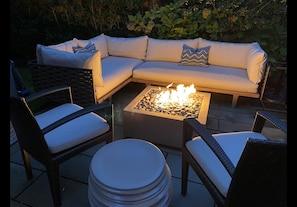 Dedon patio sofa bed with 50,000 BTU fire pit